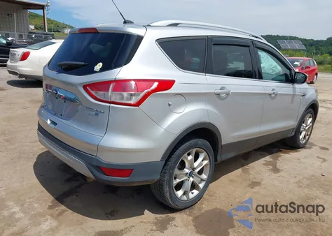 2014 Ford Escape Titanium z USA, uszkodzony, nr VIN 1FMCU9J90EUB13882